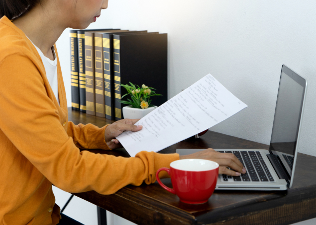 midsection-man-using-mobile-phone-while-sitting-table 1