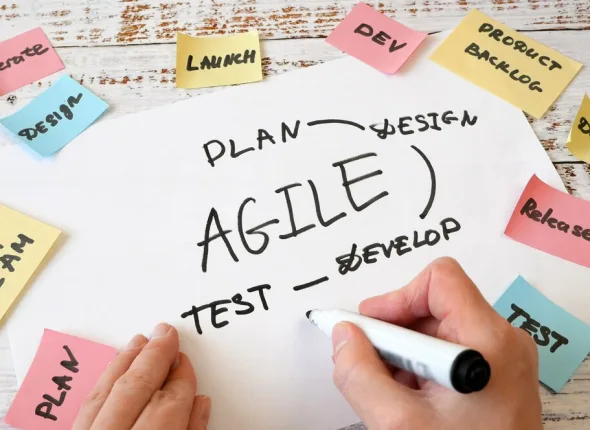 hands drawing software scrum agile board with paper task